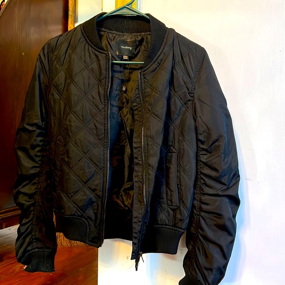 Black Bomber jacket by “The Story”